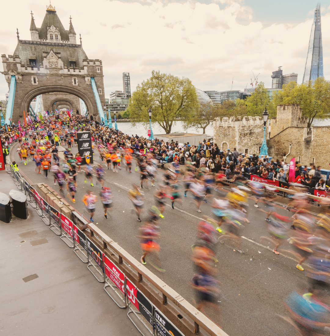 people running over london bridge in marathon race