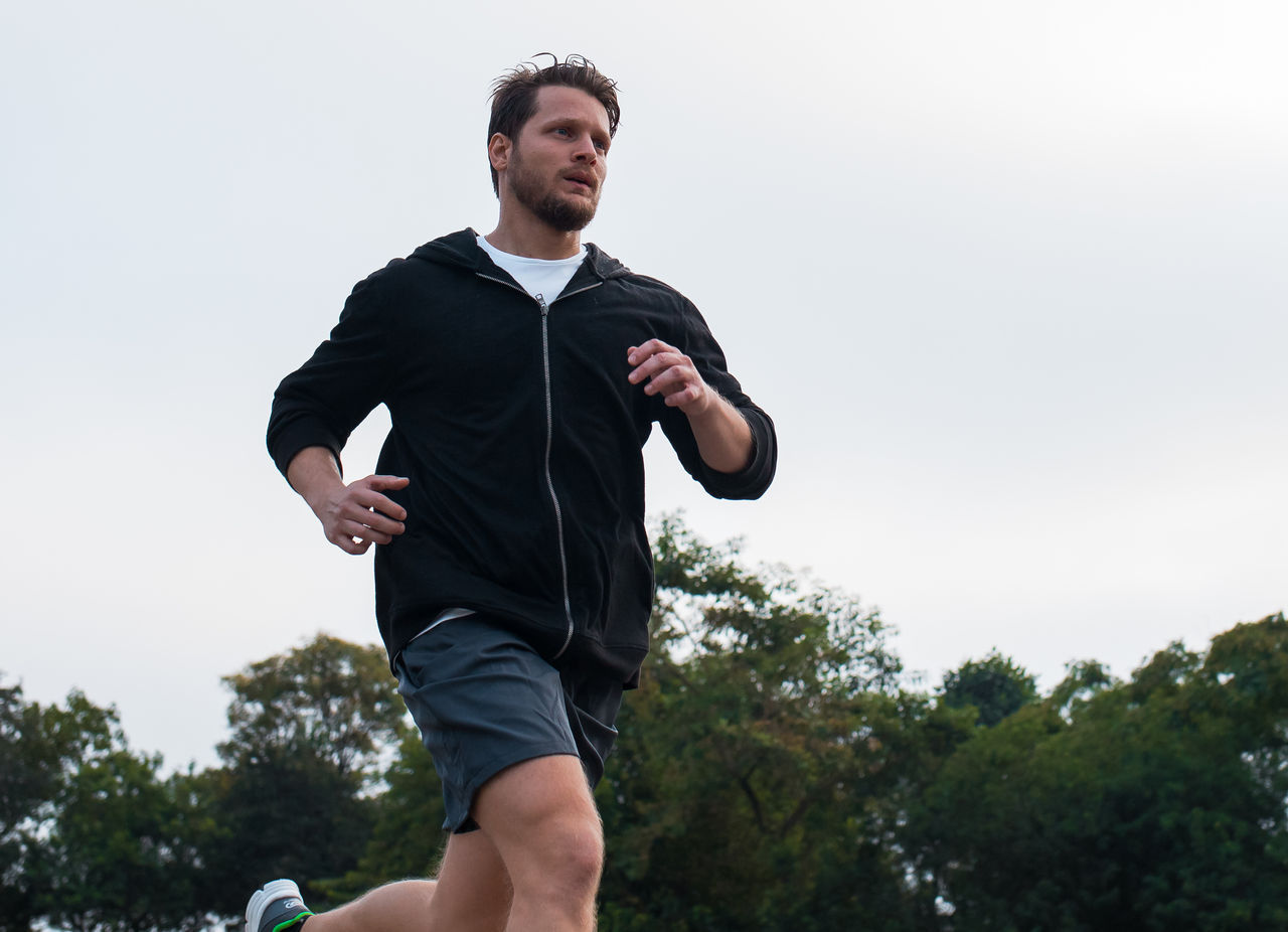 coach or nutritionist in a gym with a client