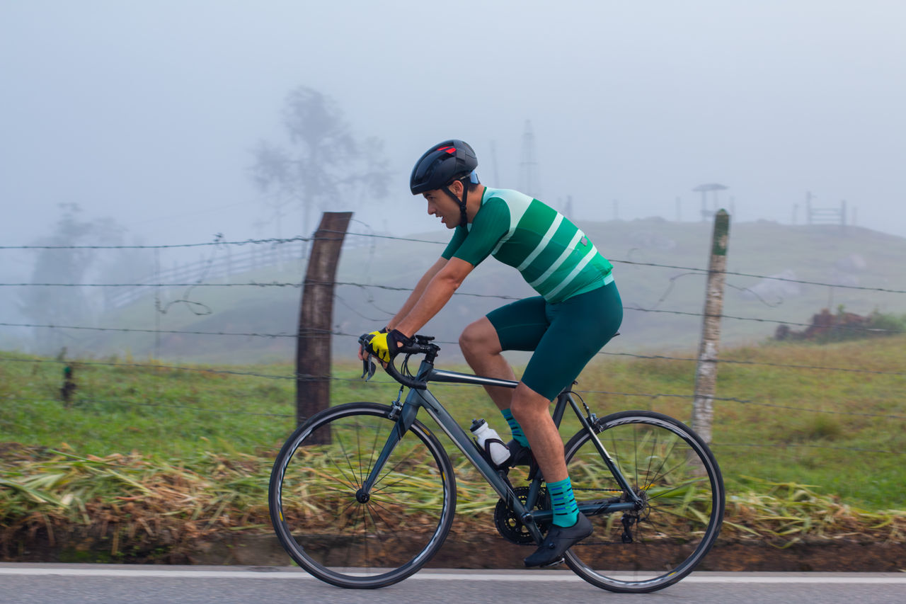 lifestyle concept. cyclist on the road training. general plan. cloudy day Indoor personal cardio training in gym; Shutterstock ID 1822207589; purchase_order: POIIG0004097; job: OMG1193295; client: Danone UK; other: 480